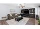 Inviting living room featuring built-in shelving and comfortable seating at 165 6Th St, Auburn, GA 30011