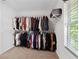 Spacious walk-in closet with abundant hanging storage and wire shelving for optimal organization at 165 6Th St, Auburn, GA 30011