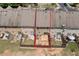 Aerial view of townhome's back exterior, patio, air conditioning, and fence at 1880 Garbrooke Cv, Lawrenceville, GA 30046
