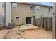 Backyard with small concrete patio, and wood fence at 1880 Garbrooke Cv, Lawrenceville, GA 30046