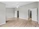Bright bedroom with ample natural light and doorway access to a walk-in closet at 1880 Garbrooke Cv, Lawrenceville, GA 30046