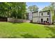 Large backyard features a well-maintained lawn, privacy fence, and deck at 2020 Bixby Se St, Atlanta, GA 30317