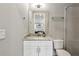 Bright bathroom features a white vanity with a granite countertop, enhancing its clean and modern appeal at 2020 Bixby Se St, Atlanta, GA 30317