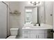 Bathroom featuring a vanity with double sinks and a shower with decorative tile at 2020 Bixby Se St, Atlanta, GA 30317
