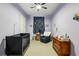 Cozy Bedroom with a crib, rocking chair, and dresser at 2020 Bixby Se St, Atlanta, GA 30317
