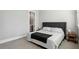 Comfortable bedroom with a plush bed, side table, and neutral decor at 2020 Bixby Se St, Atlanta, GA 30317