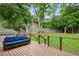 Inviting backyard deck with comfortable seating, overlooking a well-manicured lawn and greenery at 2020 Bixby Se St, Atlanta, GA 30317