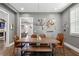 Bright dining room featuring a wooden table, unique light fixture, and decorative wall art at 2020 Bixby Se St, Atlanta, GA 30317