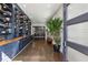 Inviting hallway featuring built-in bookshelves and hardwood floors leading to a dining area at 2020 Bixby Se St, Atlanta, GA 30317