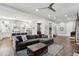 Spacious living room connected to an open kitchen, complemented by hardwood floors and neutral decor at 2020 Bixby Se St, Atlanta, GA 30317