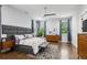 Spacious main bedroom with hardwood floors, a ceiling fan, and two large windows at 2020 Bixby Se St, Atlanta, GA 30317