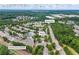 Aerial view of neighborhood near Old Peachtree Rd NE showing a two-story home in Lawrenceville, GA at 2331 Suwanee Pointe Dr, Lawrenceville, GA 30043