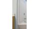 Close up of white tiled bathtub/shower combo at 2331 Suwanee Pointe Dr, Lawrenceville, GA 30043