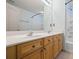 Bathroom featuring double sink vanity with white countertop and a shower/tub combo at 2331 Suwanee Pointe Dr, Lawrenceville, GA 30043