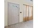 Bright entryway with neutral walls, tiled floors, and natural light filtering through sheer curtains at 2331 Suwanee Pointe Dr, Lawrenceville, GA 30043