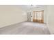 Inviting living space featuring neutral walls, tiled floors, and natural light filtering through sheer curtains at 2331 Suwanee Pointe Dr, Lawrenceville, GA 30043