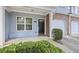 Inviting front porch featuring brick accents, and a well-manicured shrub, creating a warm welcome at 2331 Suwanee Pointe Dr, Lawrenceville, GA 30043