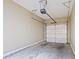View of the home's garage featuring a concrete floor and automatic door at 2331 Suwanee Pointe Dr, Lawrenceville, GA 30043