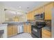A kitchen with stainless steel appliances, and granite countertops at 2331 Suwanee Pointe Dr, Lawrenceville, GA 30043