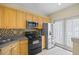 Modern kitchen with stainless steel appliances and abundant cabinet space at 2331 Suwanee Pointe Dr, Lawrenceville, GA 30043