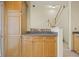 A view of the kitchen featuring light wood cabinets with stainless hardware at 2331 Suwanee Pointe Dr, Lawrenceville, GA 30043