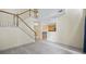 Living room with wooden staircase, hardwood floors, and kitchen view at 2331 Suwanee Pointe Dr, Lawrenceville, GA 30043