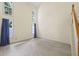 Spacious living room with hardwood floors, tall windows, and blue curtains at 2331 Suwanee Pointe Dr, Lawrenceville, GA 30043