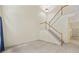 Living room showcasing hardwood floors and a staircase with wooden railing at 2331 Suwanee Pointe Dr, Lawrenceville, GA 30043
