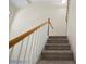 Carpeted staircase with wood and white railing at 2331 Suwanee Pointe Dr, Lawrenceville, GA 30043