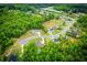 Aerial view of homes nestled in a lush, green neighborhood surrounded by trees at 445 Boulder Crest Trl, Villa Rica, GA 30180