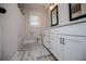 Well-lit bathroom with a vanity, toilet, and shower/bath combo at 445 Boulder Crest Trl, Villa Rica, GA 30180