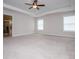 Expansive bedroom with two windows, neutral walls, and an attached bathroom at 445 Boulder Crest Trl, Villa Rica, GA 30180