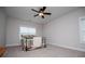 Neutral bedroom with a ceiling fan, carpet, and window at 445 Boulder Crest Trl, Villa Rica, GA 30180
