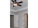 Bright bedroom featuring a ceiling fan and a doorway to another room at 445 Boulder Crest Trl, Villa Rica, GA 30180