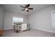 Cozy bedroom with carpet flooring, large window and ceiling fan at 445 Boulder Crest Trl, Villa Rica, GA 30180