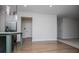 Spacious dining room with wood floors that lead into a kitchen with an island and stainless steel appliances at 445 Boulder Crest Trl, Villa Rica, GA 30180
