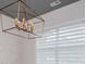 Close-up shot of modern chandelier and geometric wall design in light-filled dining room at 445 Boulder Crest Trl, Villa Rica, GA 30180