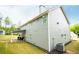 The exterior features gray siding, white trim, and a covered back patio at 445 Boulder Crest Trl, Villa Rica, GA 30180
