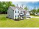 Two-story home with gray siding, black shutters, and well-manicured lawn at 445 Boulder Crest Trl, Villa Rica, GA 30180