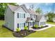 Landscaped two-story home, manicured lawn, and contrasting shutters adding curb appeal to this beautiful home at 445 Boulder Crest Trl, Villa Rica, GA 30180