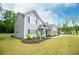 Well-maintained two-story home boasts neat landscaping, a long driveway, and a charming exterior at 445 Boulder Crest Trl, Villa Rica, GA 30180