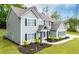 Beautiful two-story home featuring black shutters, gabled roof, covered porch and well-manicured lawn at 445 Boulder Crest Trl, Villa Rica, GA 30180