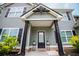 Attractive front porch with stylish pillars, manicured shrubs, and well-lit address display at 445 Boulder Crest Trl, Villa Rica, GA 30180
