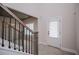 Bright hallway with iron and wood stair railing provides great views at 445 Boulder Crest Trl, Villa Rica, GA 30180