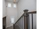 Open hallway features a modern chandelier and plenty of natural light at 445 Boulder Crest Trl, Villa Rica, GA 30180