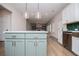 Open concept kitchen with island, stainless steel dishwasher, white cabinets, and views into the Gathering room at 445 Boulder Crest Trl, Villa Rica, GA 30180