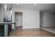 Bright living room featuring hardwood floors and white walls with a kitchen view at 445 Boulder Crest Trl, Villa Rica, GA 30180