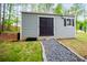 Storage shed with gray gravel path in backyard at 445 Boulder Crest Trl, Villa Rica, GA 30180