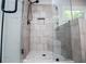Modern shower with glass enclosure, sleek fixtures, and tile design at 445 Boulder Crest Trl, Villa Rica, GA 30180