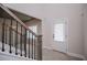 Staircase view with light gray walls and black metal banister at 445 Boulder Crest Trl, Villa Rica, GA 30180